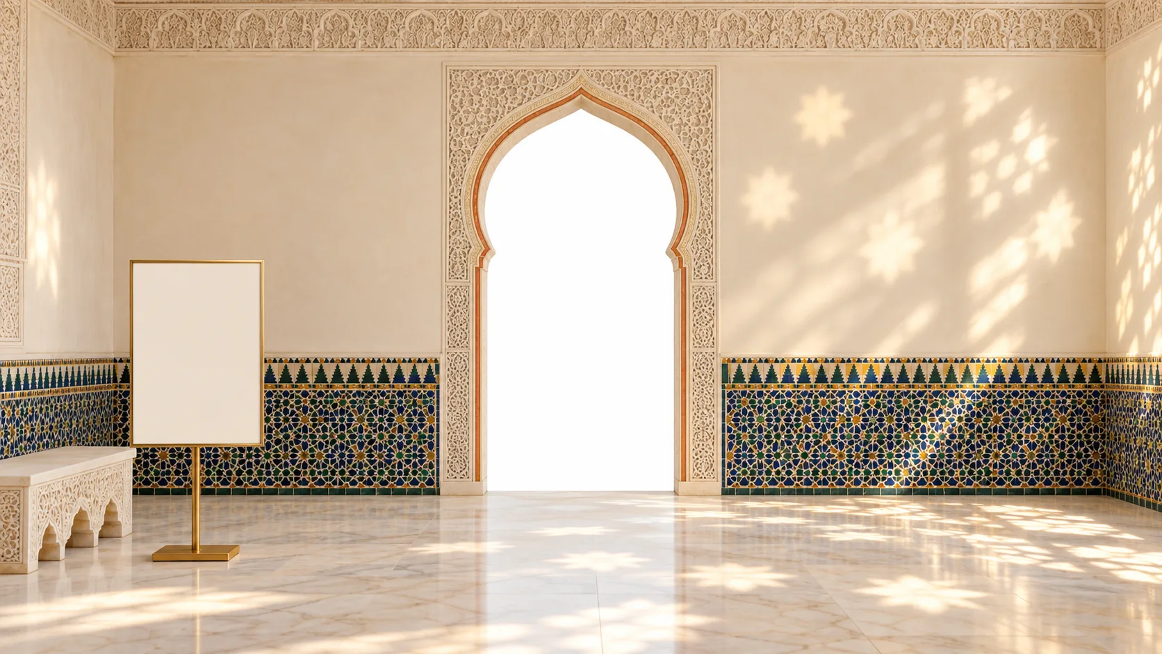 A sunlit Andalusian room with ivory carved plaster, cobalt and green tiles and a niche-shaped doorway